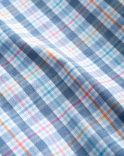 fabric closeup of checkered sportshirt with blue large stripe and thin gold and magenta
