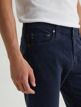 Close-up of side pockets on navy trouser