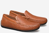 Pair of brown woven loafers on a white background