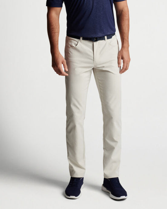 man with ivory pants