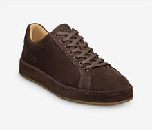 Brown suede sneaker on a white background