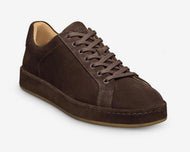 Brown suede sneaker on a white background