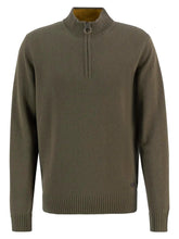 Green sweater with a quarter zip on a white background