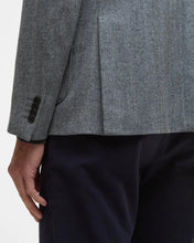 Gray textured blazer and black pants on a white background