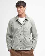 man in waist canvas jacket with button snap front
