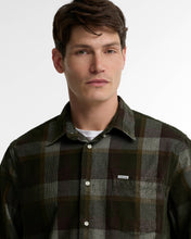 man in Barbour long-sleeve plaid cord shirt in olive and brown