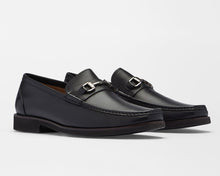 A pair of black leather penny loafers with silver-tone horsebit hardware, displayed on a clean white studio background.