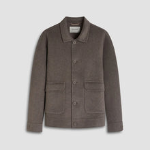 Gray jacket with button details on a light gray background