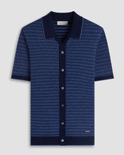 Blue patterned shirt with contrasting collar on a light gray background