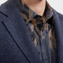 close up of navy wool blazer lapel