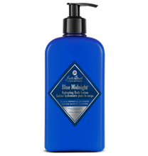 Blue bottle of Jack Black Blue Midnight Hydrating Body Lotion on a white background