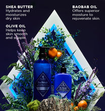 Two blue bottles with a decorative triangle and plants on a dark background