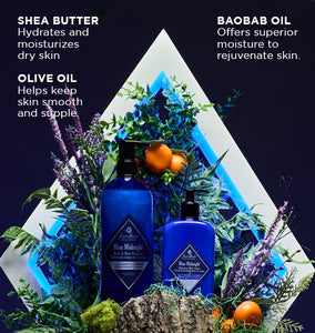 Two blue bottles with a decorative triangle and plants on a dark background