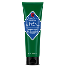 Green tube of Jack Black hair and beard balm on a white background