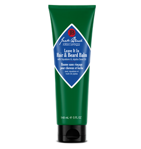 Green tube of Jack Black hair and beard balm on a white background