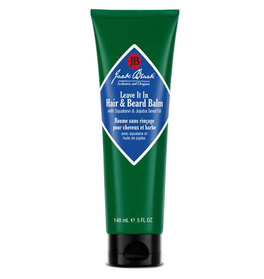 Green tube of Jack Black hair and beard balm on a white background