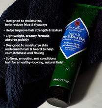 Green jar of Jack Black hair and beard balm with product description text on a dark background
