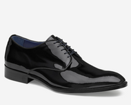 Black patent leather dress shoe on a white background