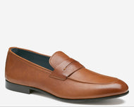 Brown leather loafer shoe on a white background