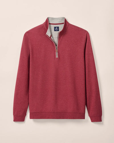 Red quarter-zip sweatshirt on a beige background