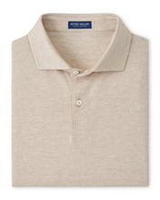Beige polo shirt with Peter Millar label on a white background