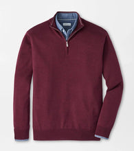 Maroon half-zip sweater on a light gray background