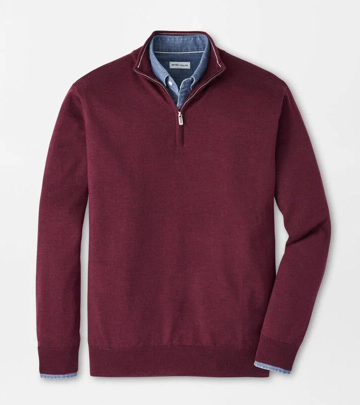 Maroon half-zip sweater on a light gray background