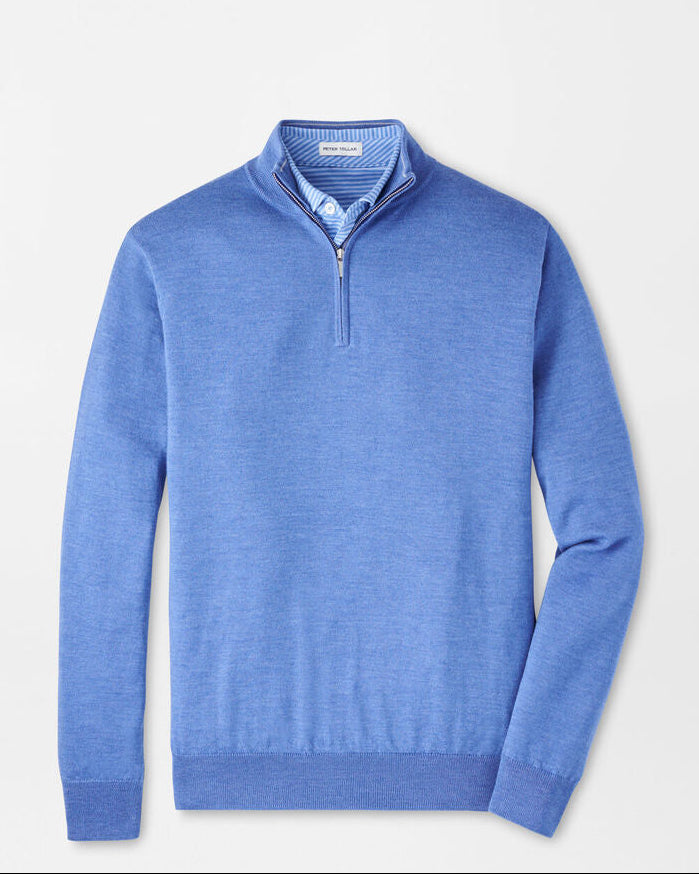 Blue sweater with a zipper on a light gray background