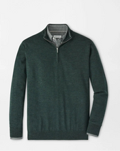 Green quarter-zip sweater on a light gray background