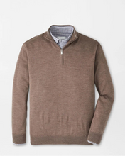 Brown quarter-zip sweater on a light gray background