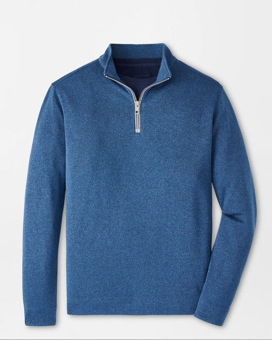Blue pullover with a quarter zip on a light gray background