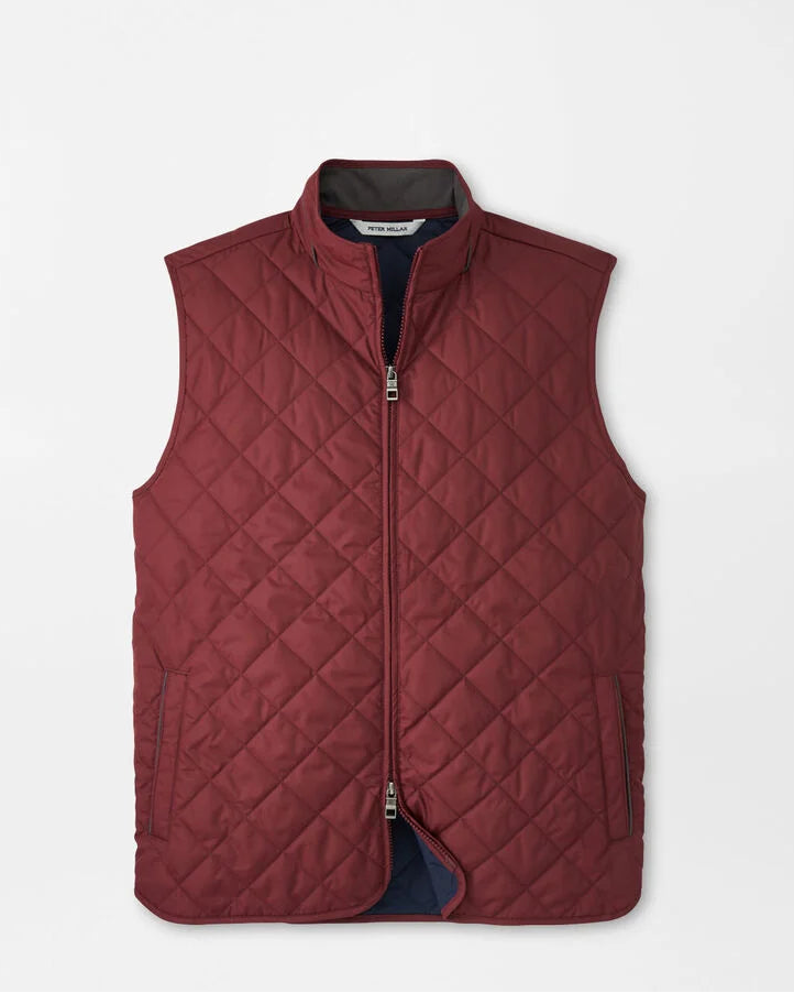 Quilted vest with diamond pattern on a light gray background