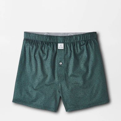 Green boxer shorts on a light gray background