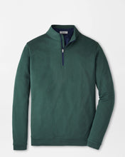 Green long-sleeve shirt with a quarter zip on a light gray background