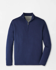 Blue textured pullover on a light gray background