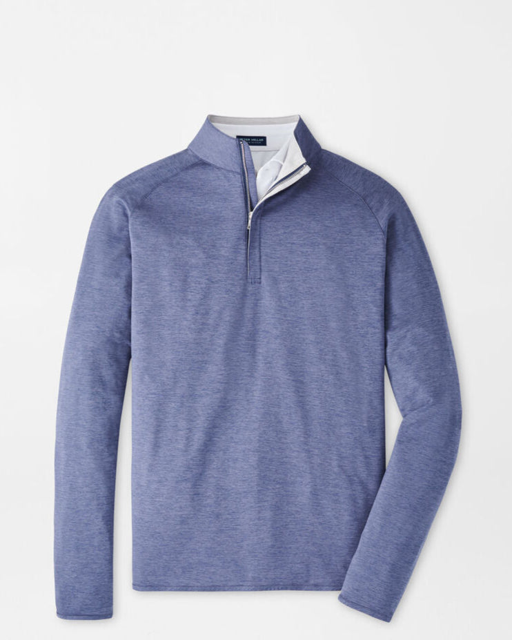Blue long-sleeve shirt with a quarter zip on a light gray background