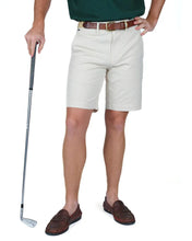 man in stone colored shorts