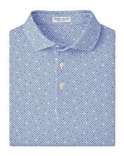Blue patterned polo shirt on a light gray background