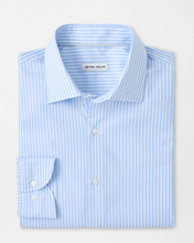 Folded blue and white striped shirt with 'Peter Millar' label on a light gray background