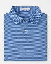 Folded blue striped polo shirt with a brand label on a light gray background