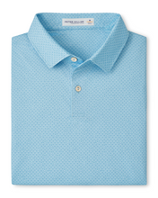 Light blue patterned polo shirt with small martini glasses on a white background