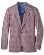 Plaid blazer with a blue shirt underneath on a white background