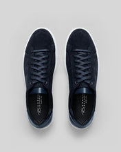 Black sneakers on a light gray background