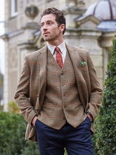 Man in camel tweed blazer over a 4-button companion vest