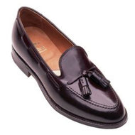 A single burgundy-colored Alden Tassel Moccasin shoe with a visible tassel and a smooth, polished leather finish.