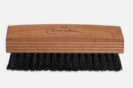 A black polishing brush with a Sipo hardwood handle and boar bristles, branded with 'Saphir'.