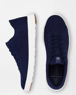navy sneaker with white sole